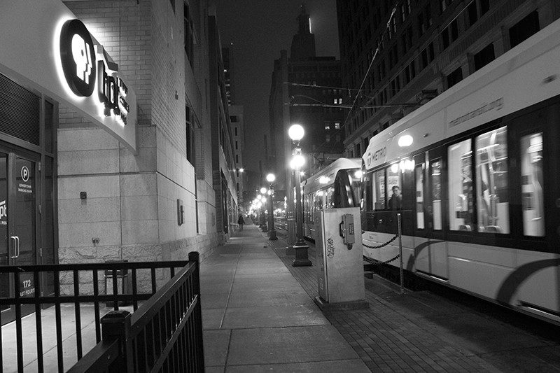 Photo of light rail train passing the TPT Twin Cities PBS office building in downtown St. Paul